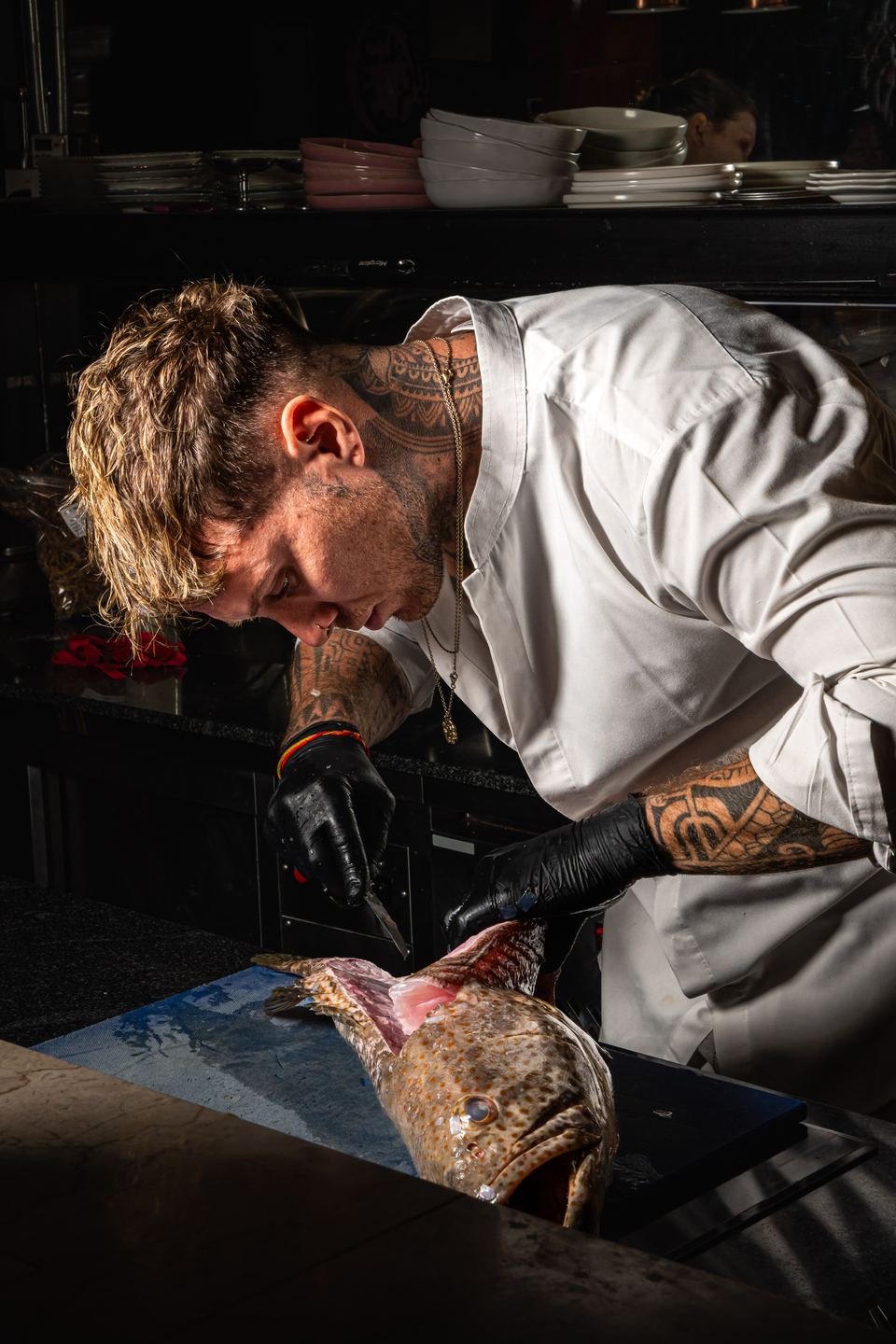 Antoine Darquin breaking down fish in the Bisou kitchen