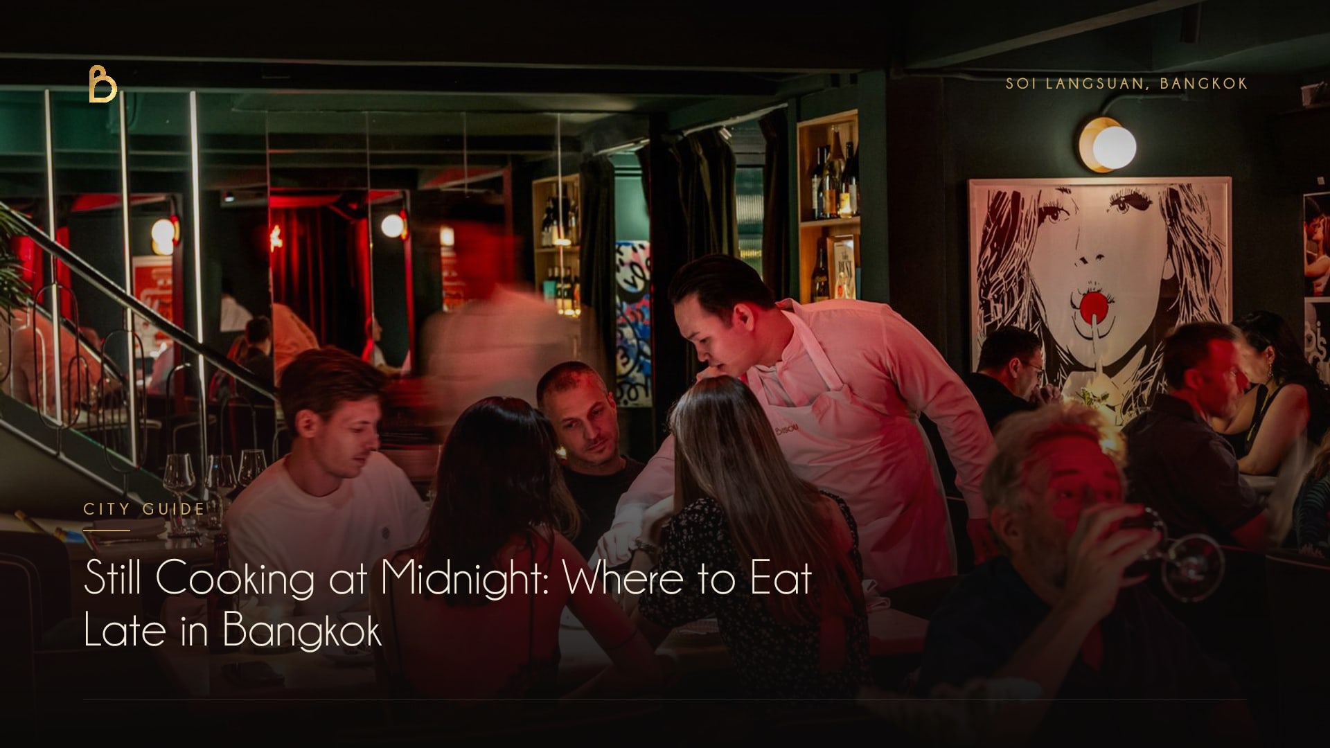 A full dining room late at night at Bisou, a modern French restaurant on Soi Langsuan, Bangkok